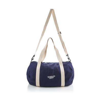 Cotton Barrel Duffel bag in navy with adjustable strap and carry handles, perfect for travel and gym use.