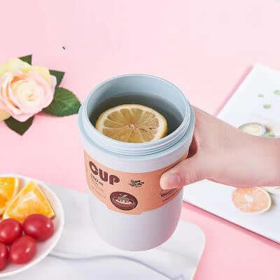 Eco Friendly Portable Bamboo Fiber Coffee Mug with lemon slice, perfect for corporate gift and sustainable hydration.
