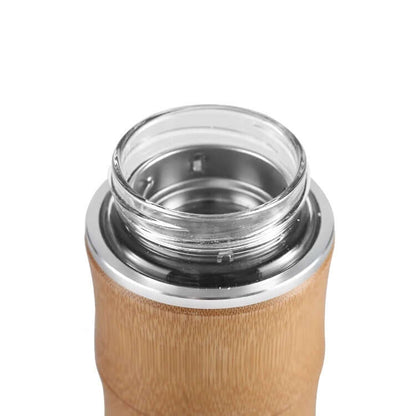 Close-up of the opening of a 450ml Bamboo Glass Thermal Bottle with bamboo exterior and metal cap.