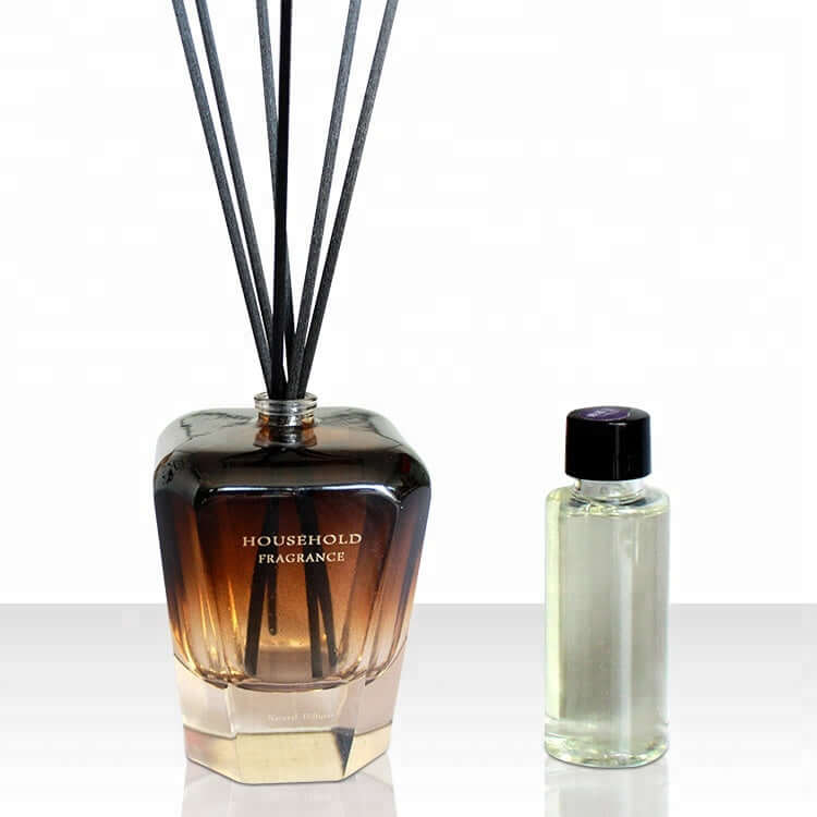 Bamboo Stick Essential Oil Fragrance Reed Diffusers next to a fragrance oil bottle.