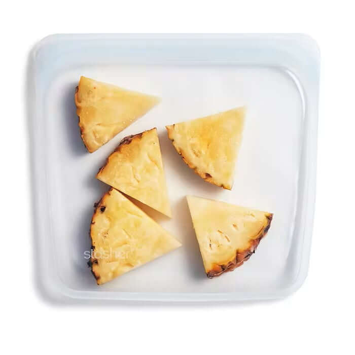Stasher Sandwich Bag 828ml holding pineapple slices, an eco-friendly food storage solution.