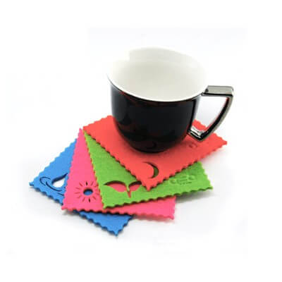 OSSI Nature Coaster Set with unique designs stacked under a black cup, ideal for a Corporate Gift.