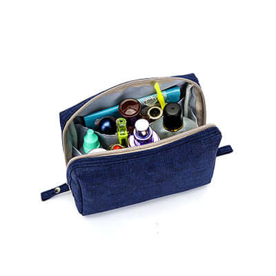Snow Canvas Travel Organiser Pouch in Navy Blue, packed with essentials for travel organization.