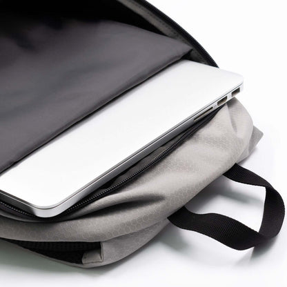 BrandCharger Nomad Eco Backpack featuring a dedicated laptop compartment with a laptop inside.