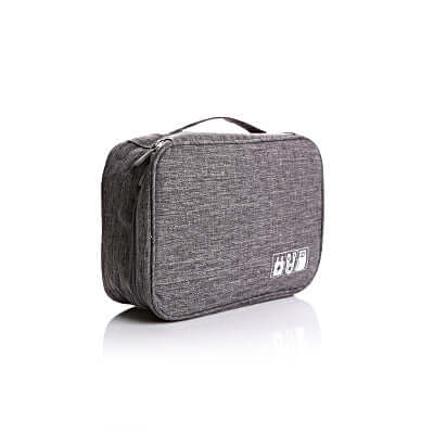 Travel Digital Pouch in grey fabric, ideal for organizing cables and tech accessories on the go.