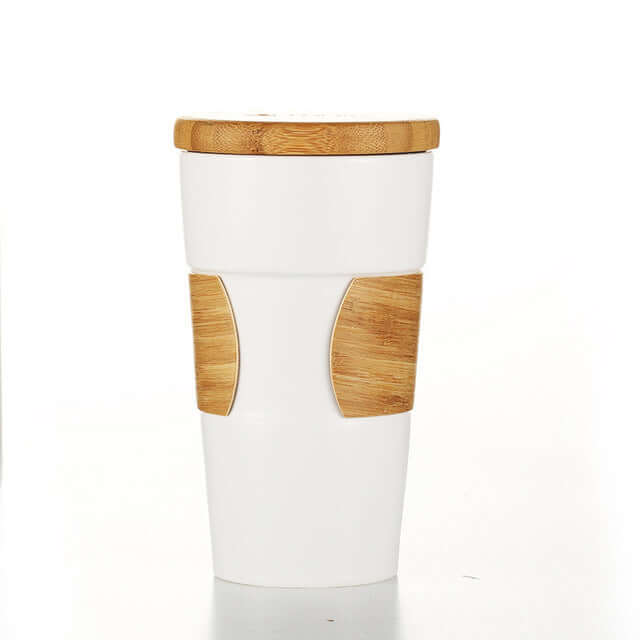 Eco Friendly Ceramic Mug with Bamboo Lid and Sleeve featuring a stylish bamboo design for hot beverages.