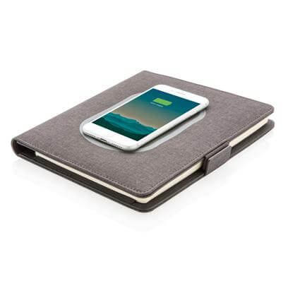 A5 Notebook with Wireless Charger 5W with smartphone charging on front cover, perfect corporate gift.