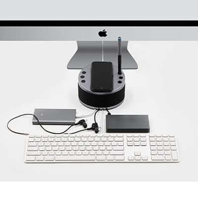 BrandCharger LYNQ Desktop Holder with Speaker and USB Hub on a desk with keyboard and accessories.