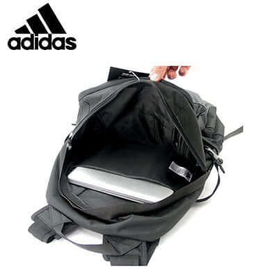 Interior view of the adidas Golf Backpack showcasing space for golf essentials and a laptop.