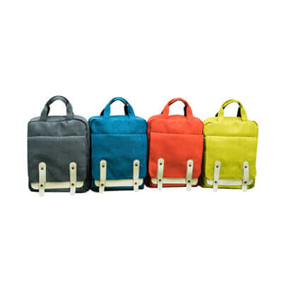 Four Trendy Canvas Backpacks in grey, blue, red, and yellow, perfect for a stylish accessory or corporate gift.