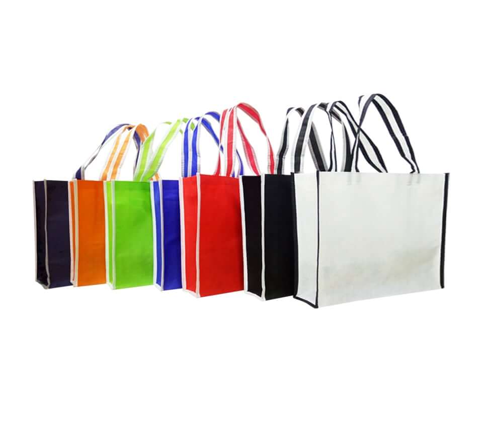 A3 Landscape Non-Woven Bag with Trimmings in vibrant colors including Red, Blue, Green, and Black.