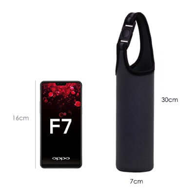 BUCKLE Release Neoprene Thermos Mug Cover next to a smartphone for size comparison, showcasing its sleek design.