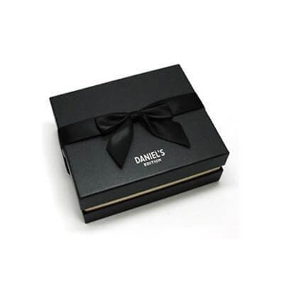 Elegant black gift box with a ribbon, ideal for packaging premium items like Luggage Tag | Calfskin Leather | Swarovksi.