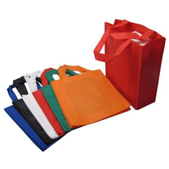 Non Woven Bag (22cm x 9cm x 25cm) in various colors including red, green, blue, and orange for daily essentials.
