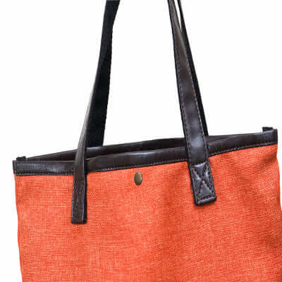 Foldable Shopping Cart Bag in vibrant orange color with dark leather handles for stylish shopping.