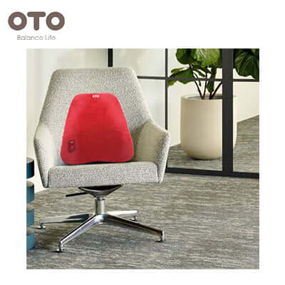 OTO Back Support placed on a chair in a modern office setting, ideal for corporate gift and improved posture.