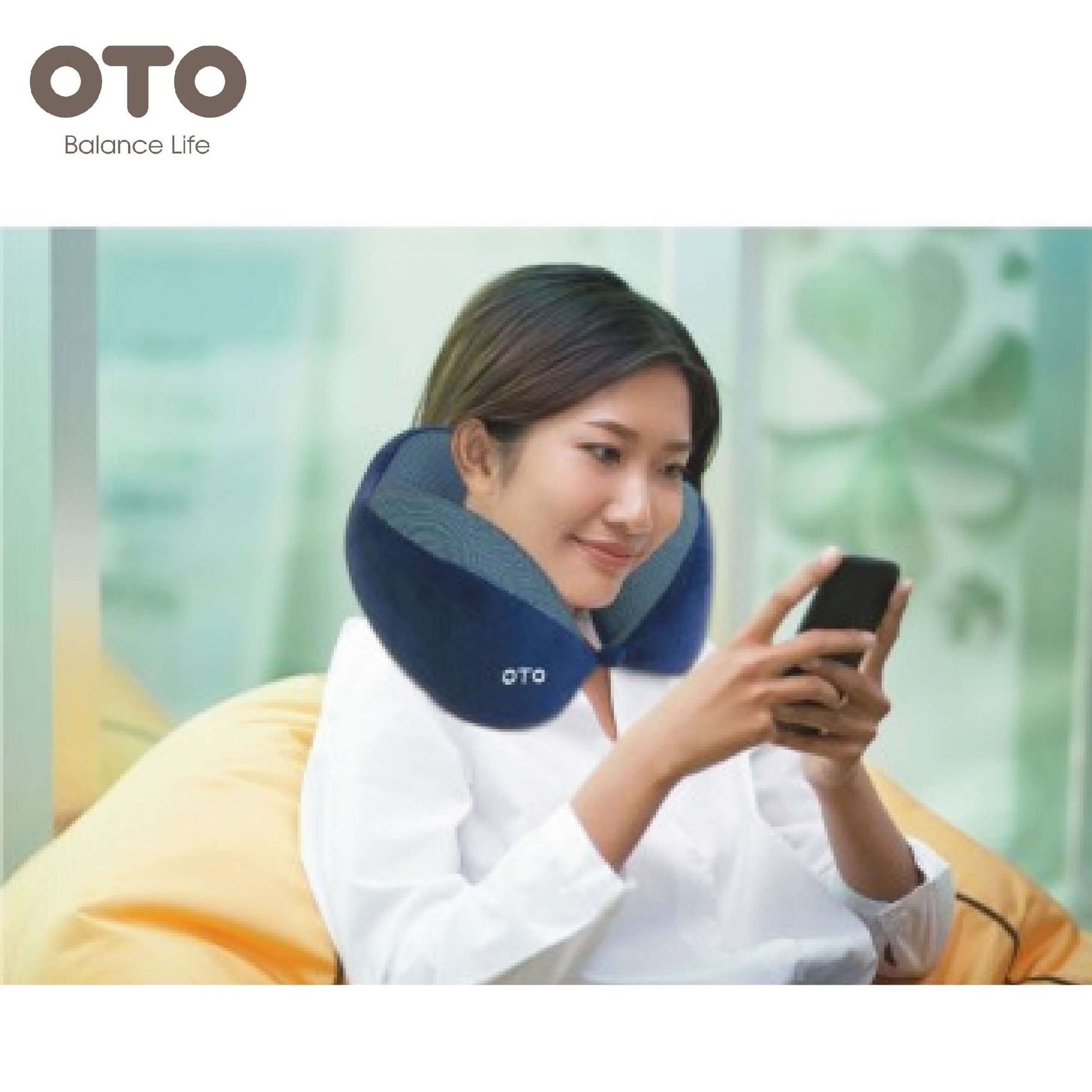 Woman relaxing with OTO Neck Relaxar neck massager while using a smartphone.