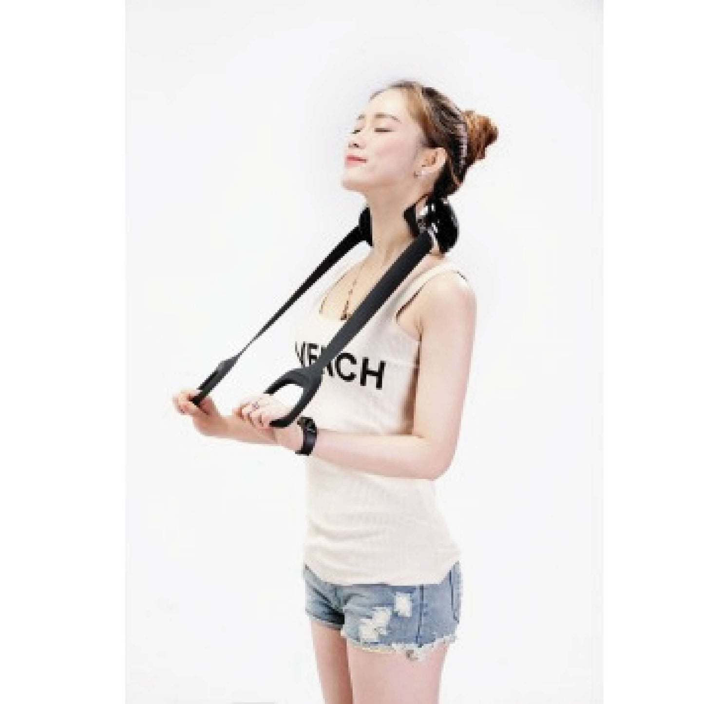 Woman enjoying a massage with the OTO Neck Spa, showcasing its wireless and portable design.