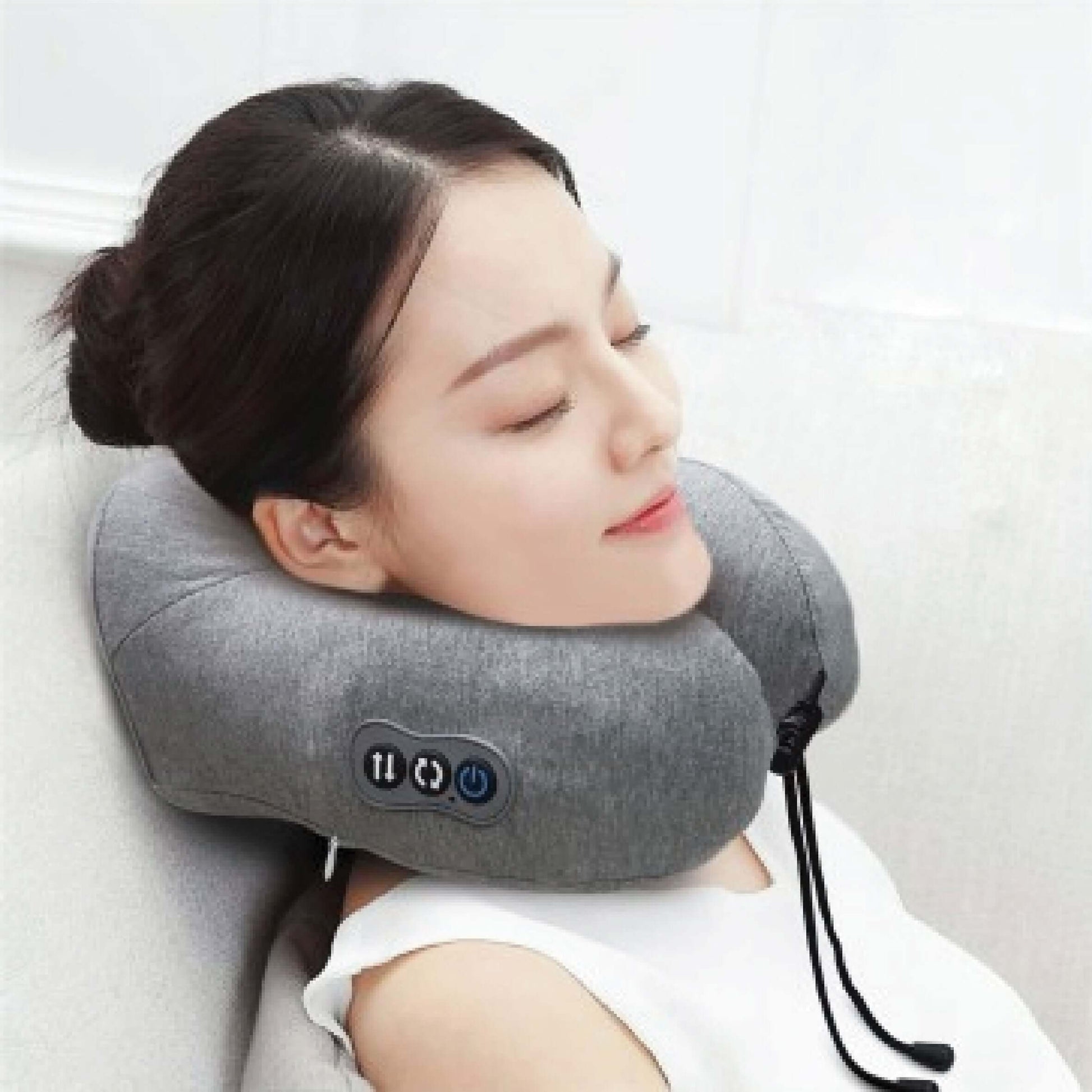 A woman relaxing with the OTO Soothie neck massager, designed for stress relief and comfort.