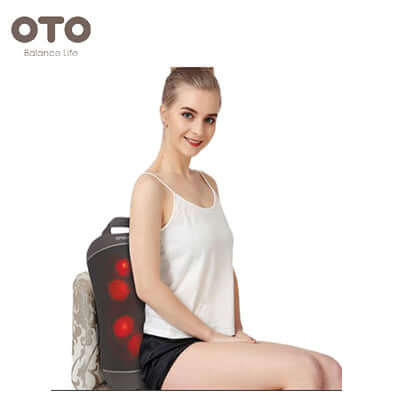 A woman enjoying a massage with the OTO Spinal Spa back massager, showcasing its sleek design and powerful relaxation features.
