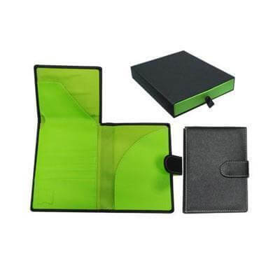 Muse Passport Holder in black and bright green interior, ideal for travel and corporate gift. Expandable design for documents.