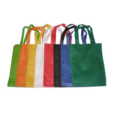 Colorful Portrait Non Woven Bags (100gsm) arranged in a row, ideal for corporate gifts and everyday use.