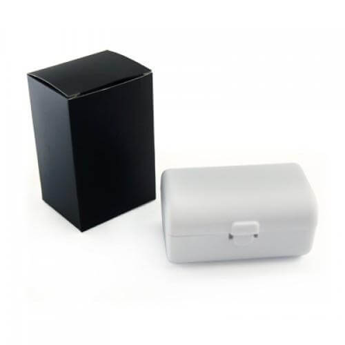 Travel Adaptor With USB Hub And box in a sleek packaging with a black box and a white case.
