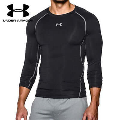 Under Armour Long Sleeve Compression Shirt modeled by a man, showcasing its tight fit and stylish design.