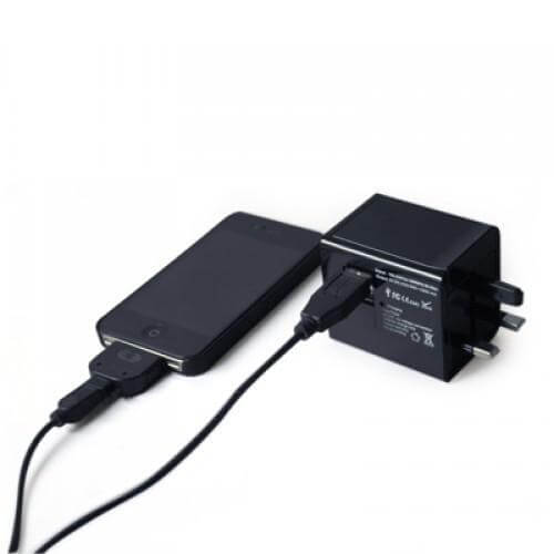 Universal AC USB Charger with Power Bank charging a smartphone, ideal as a corporate gift.