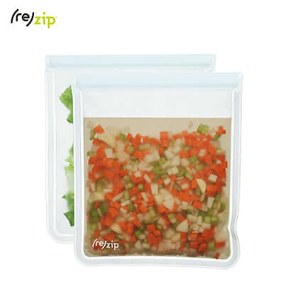 Rezip Lay-Flat Gallon Leakproof Reusable Storage Bag 2-pack filled with diced vegetables.